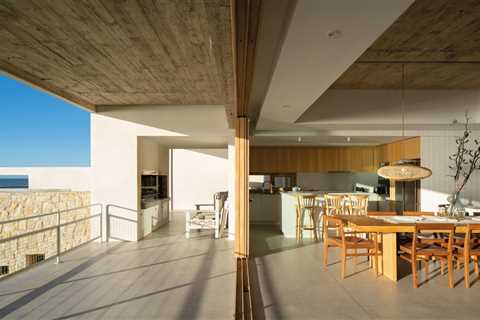 A Concrete Home on the Coast of Argentina Uses Stone to Connect Land and Sea