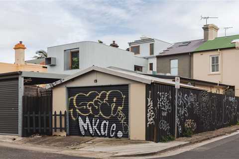 A Terrace Home’s Corrugated Steel Addition Hides Surprisingly Elegant Interiors