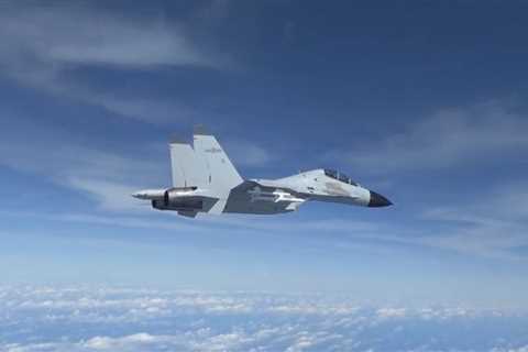 A Chinese fighter jet flew within 20 feet of a US military plane over the contested South China Sea, forcing it to take evasive action