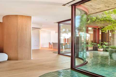 Supple Lines and Lush Outdoor Areas Revive an Apartment in a Madrid Landmark