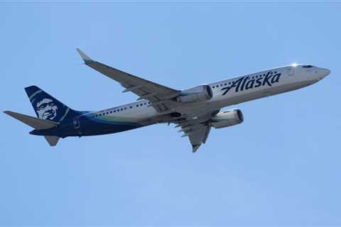 A woman is accused of threatening to kill a flight attendant after falling asleep in an Alaska Airlines flight bathroom