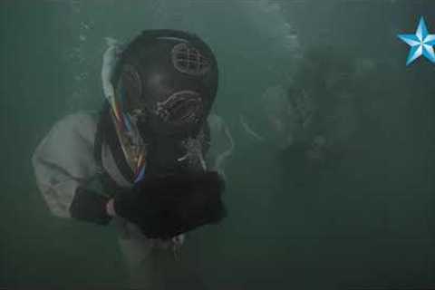 Divers place USS Arizona crew member Lauren Bruner's urn onto famed battleship