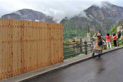 A village that's believed to have inspired the film 'Frozen' has a wall installed to stop tourists flocking there for selfies