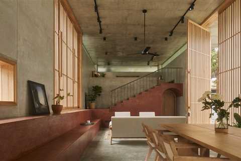 A Ribbon of Red Seating Ties Together a Sublime Concrete Home in India