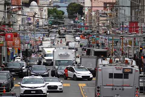 Cops yell at stalled self-driving Cruise car to get out of the way during a mass shooting in San Francisco, video shows