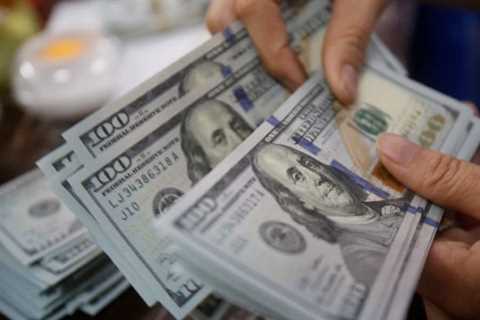 Dollar sinks to a 14-month low as waning inflation kills bets for further Fed interest-rate increases
