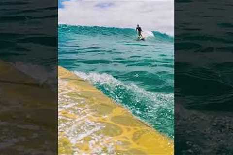 Surfer on a BEAUTIFUL clear wave in Hawai'i