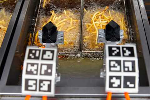 Robots are taking over fast-food kitchens. See how chains are using automation to make chips, salads, burgers, and fries. 