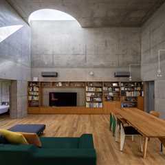 Half-Moon Cutouts Cast Dramatic Light Across This Concrete Home in Tokyo