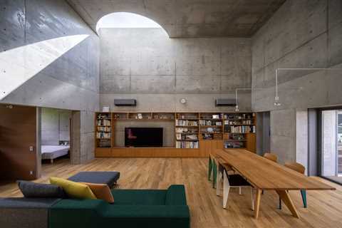 Half-Moon Cutouts Cast Dramatic Light Across This Concrete Home in Tokyo