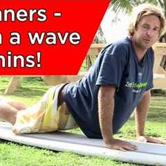 How to stand up on a surfboard