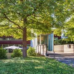 Cross the Bridge to Enter This $1.4M Dallas Home Wrapped in Cor-Ten Steel