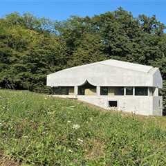 A Ribbon of Windows Wraps This Concrete Cabin in Switzerland