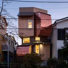 In Tokyo, Curved Copper Volumes and Hinoki Wood Boxes Build This Home Up, Not Out