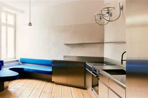 A Curvy Blue Banquette Solves a Tiny Berlin Apartment’s Puzzling Shape