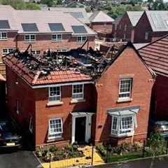 Moment solar panels on £600k house go up in flames with family inside | SWNS