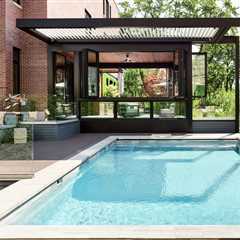 This $7.7M Classic Chicago Home Made of Limestone and Brick Hides a Striking Sunroom