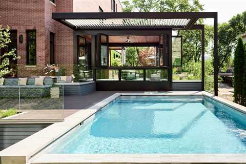 This $7.7M Classic Chicago Home Made of Limestone and Brick Hides a Striking Sunroom
