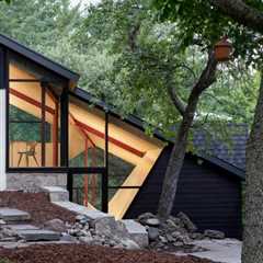 A Massive New Roof Turns a ’70s Chalet in Canada Into a Forest Palace