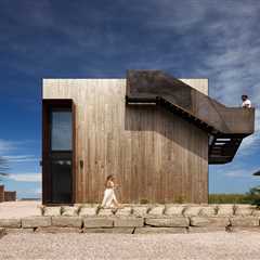 Foul Weather Is No Match for This Boxy New Brunswick Home—or the Steel Stair Wrapped Around It