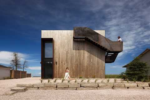 Foul Weather Is No Match for This Boxy New Brunswick Home—or the Steel Stair Wrapped Around It