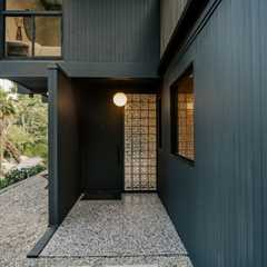 This $2.8M L.A. Midcentury Has an Ink-Black Facade and Bright-White Interiors