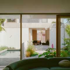 It’s Made From Glass Bricks, But Their Backyard Studio Is Anything But ’80s